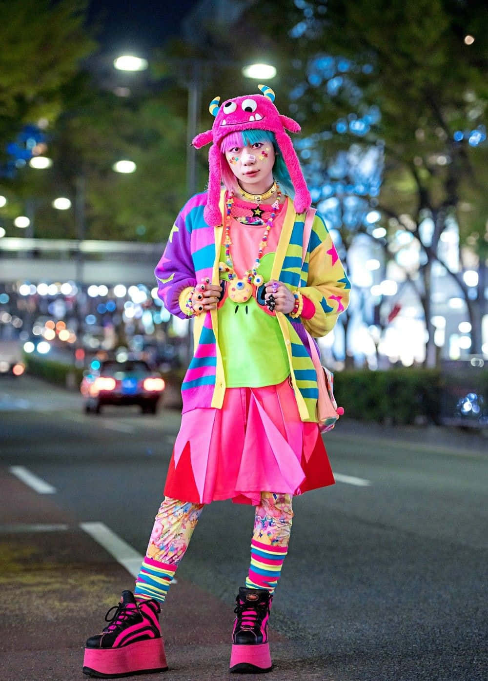 Stylish friends posing in vibrant Harajuku street fashion Wallpaper