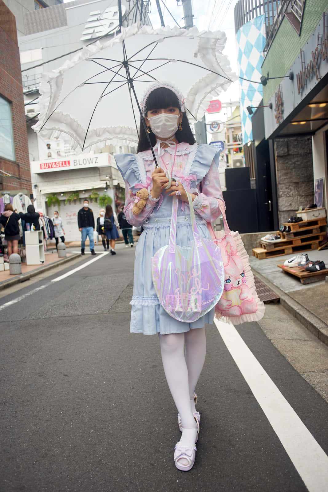 Trendy Harajuku Fashionistas Posing in Tokyo Wallpaper