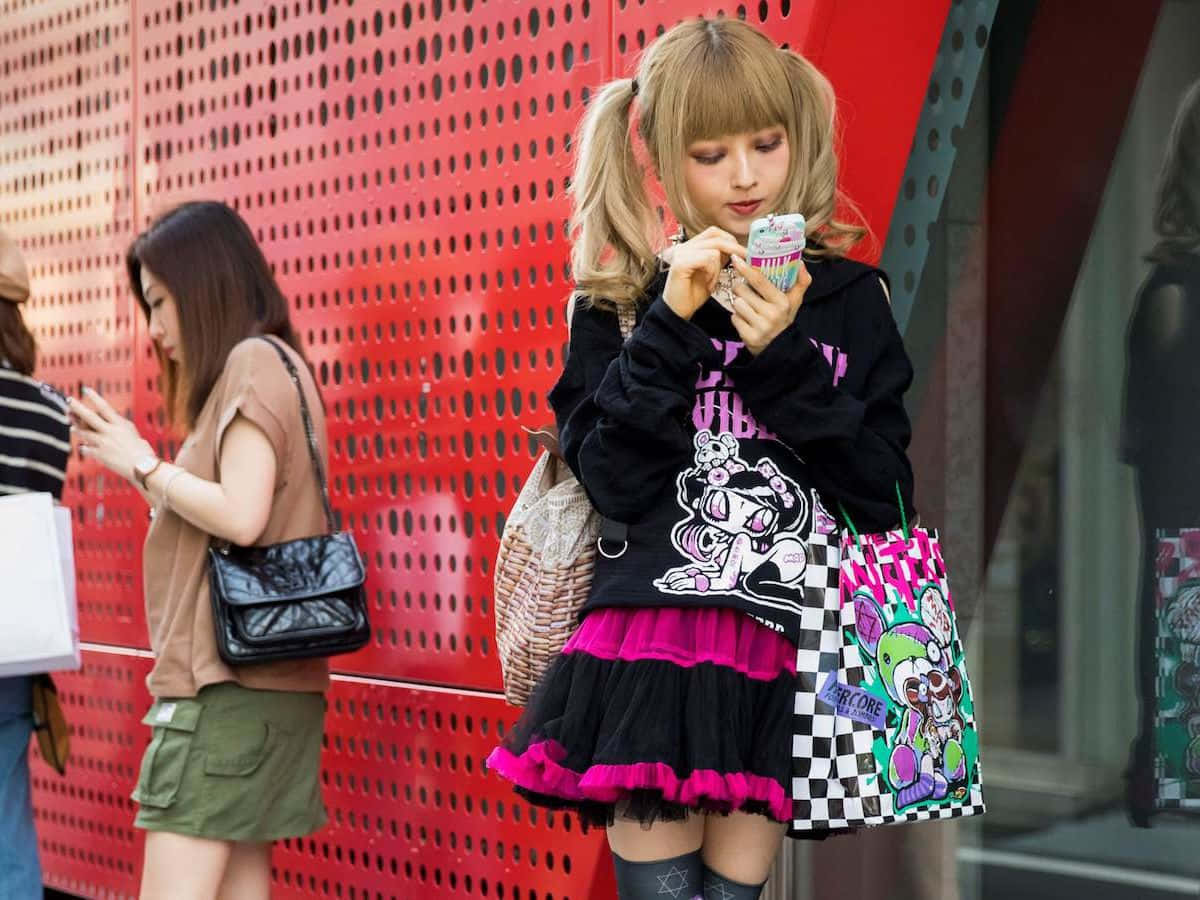 Trendy Harajuku fashionistas showcasing vibrant street style Wallpaper