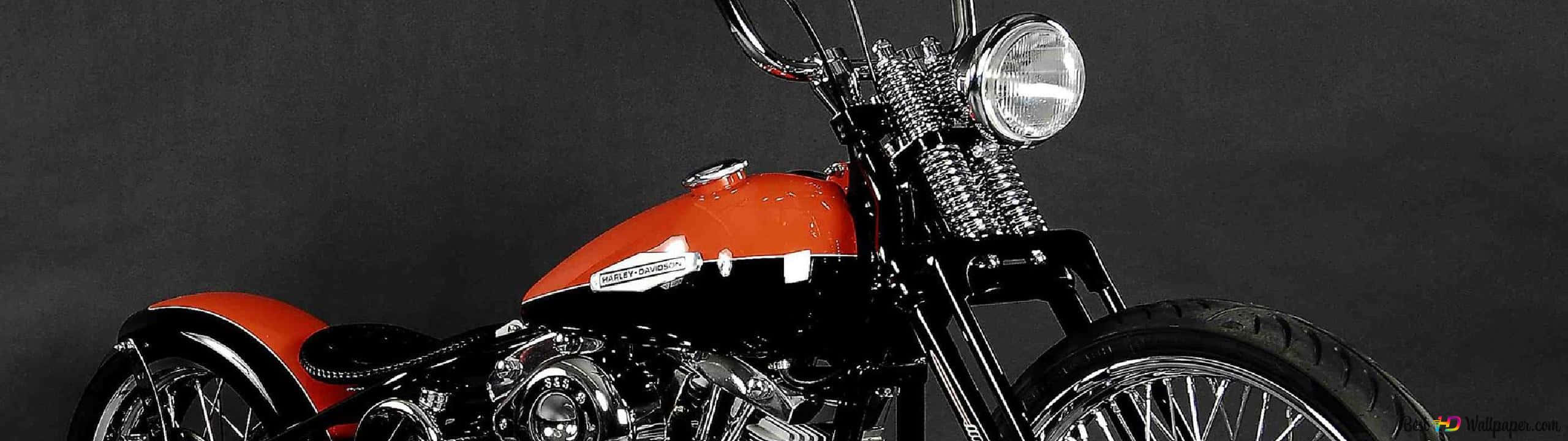 A majestic Harley-Davidson HD motorcycle parked on the street Wallpaper