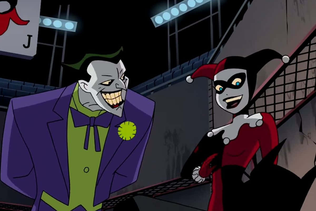 The iconic duo Harley Quinn and Joker in a playful Cartoon scene. Wallpaper
