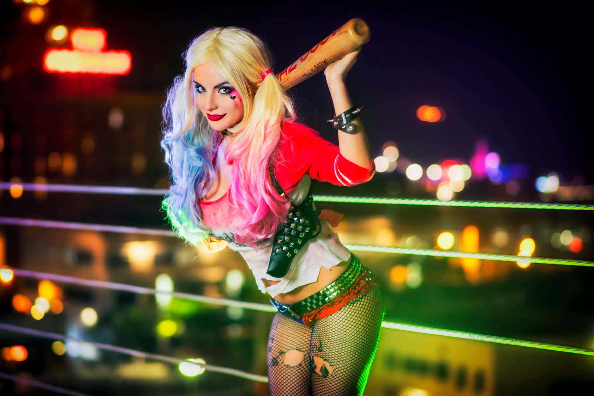Remarkable Harley Quinn Cosplay In Action Wallpaper