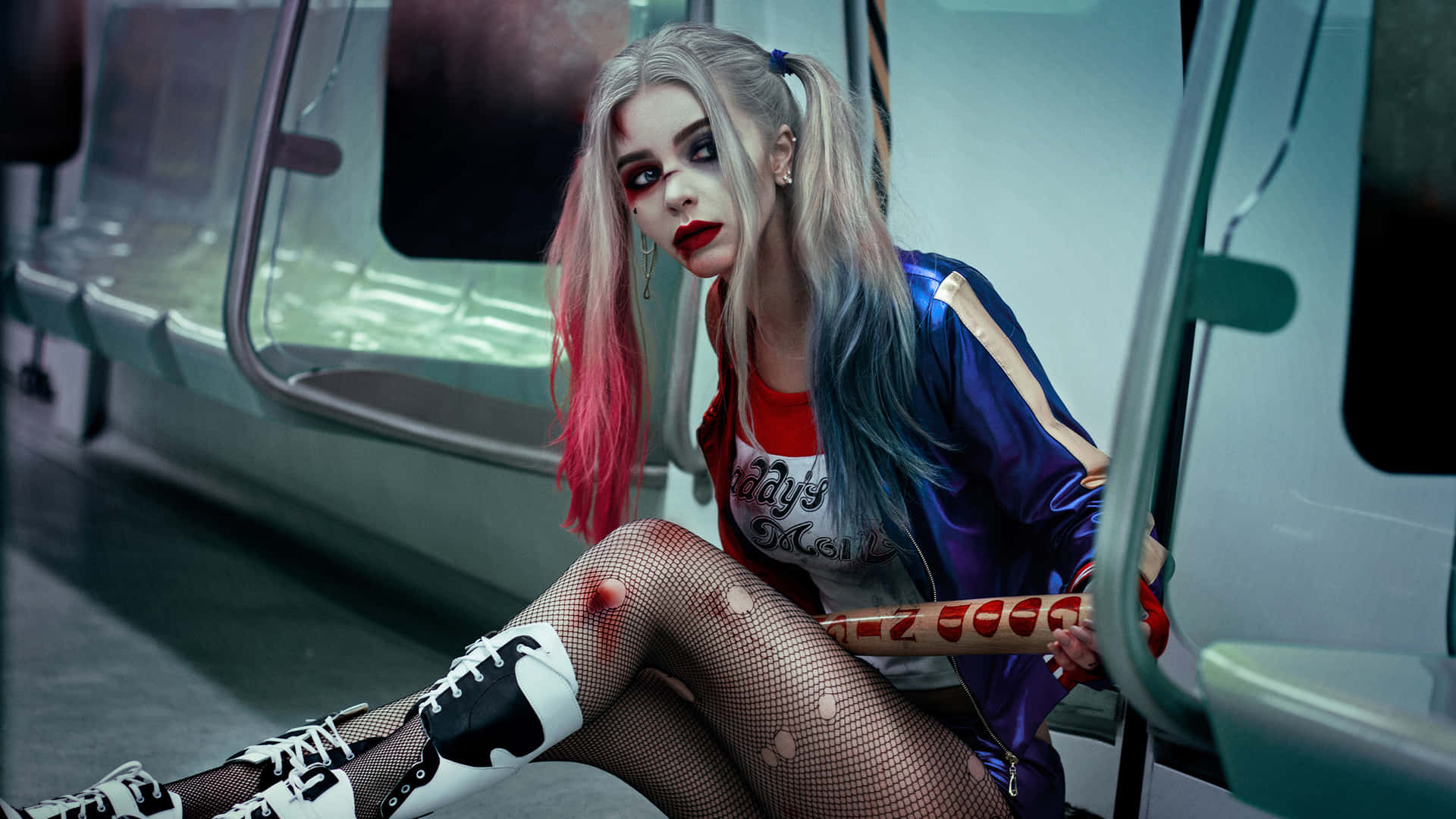 Stunning Harley Quinn Cosplay with Iconic Red and Blue Costume Wallpaper