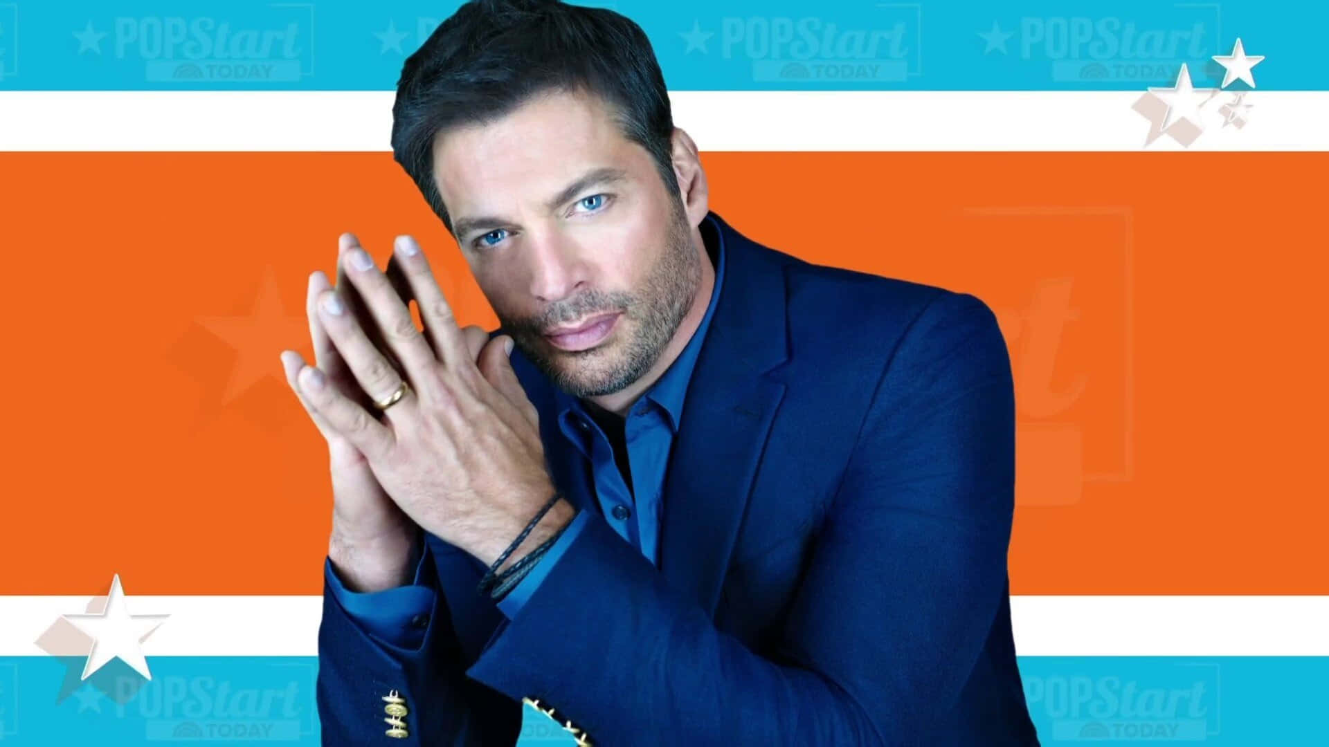 Harry Connick Jr. in a dapper suit, standing confidently against a simple background Wallpaper