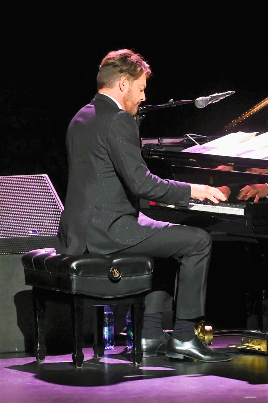 Harry Connick Jr. on stage during a live performance Wallpaper