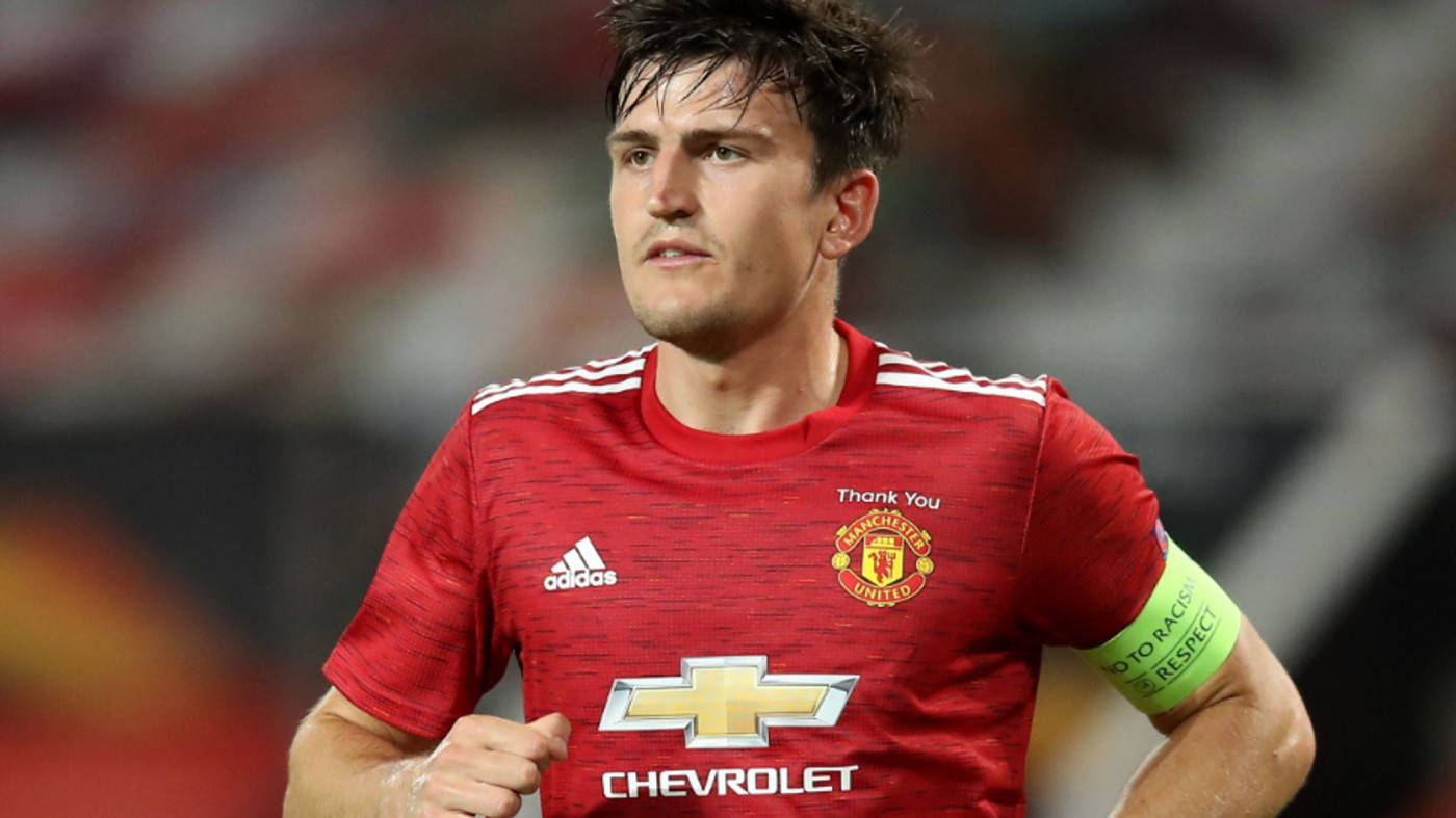 Harry Maguire Running With A Red Uniform Wallpaper