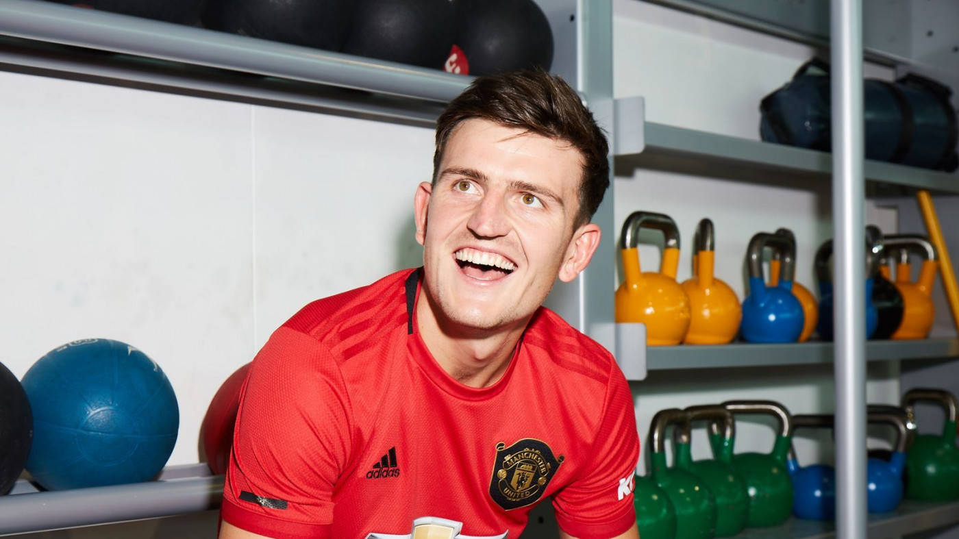 Harry Maguire Smiling And Looking Towards The Side Wallpaper