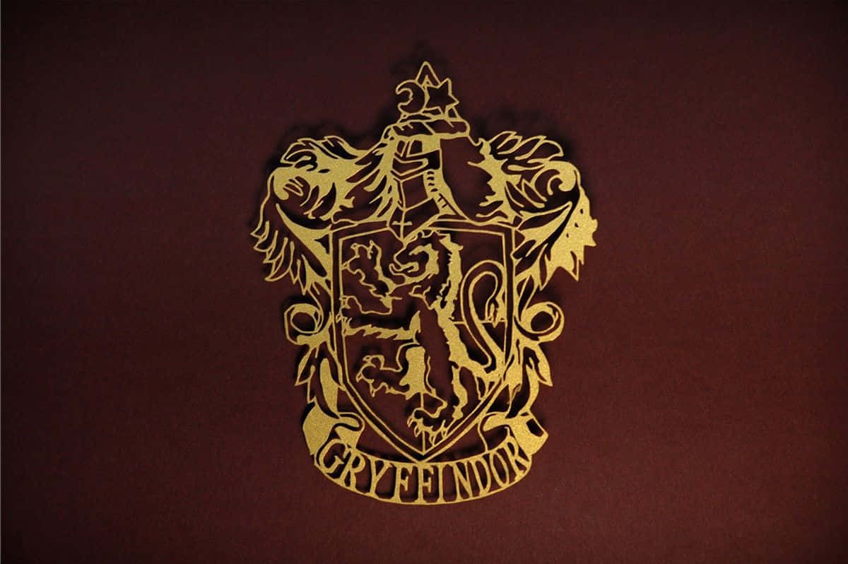 Det officielle flag for Hogwarts Huset Gryffindor pryder tapetet. Wallpaper