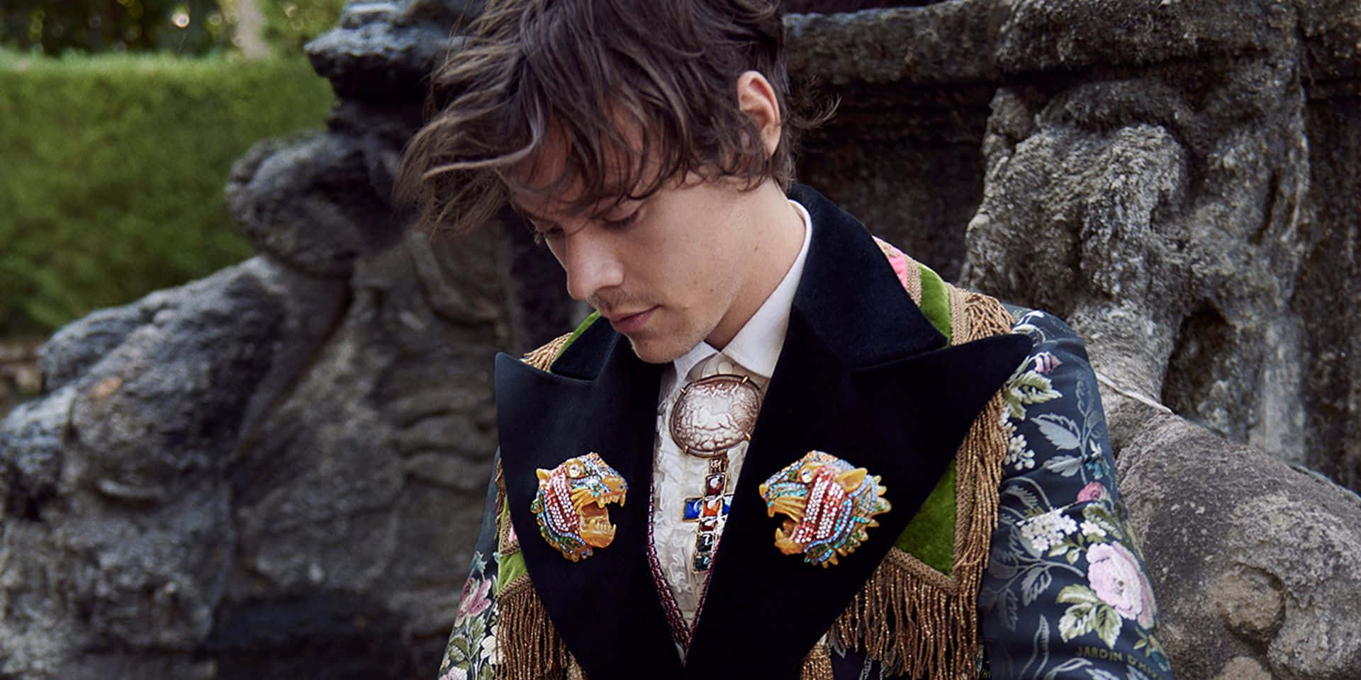 Harry Styles Hunches Over His Laptop Wallpaper