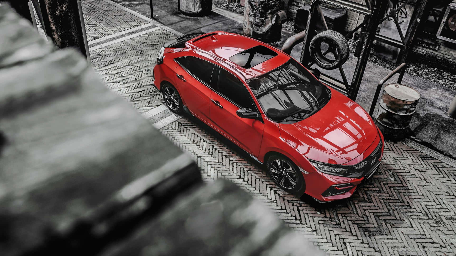 Stylish, Sleek Red Hatchback in Action Wallpaper