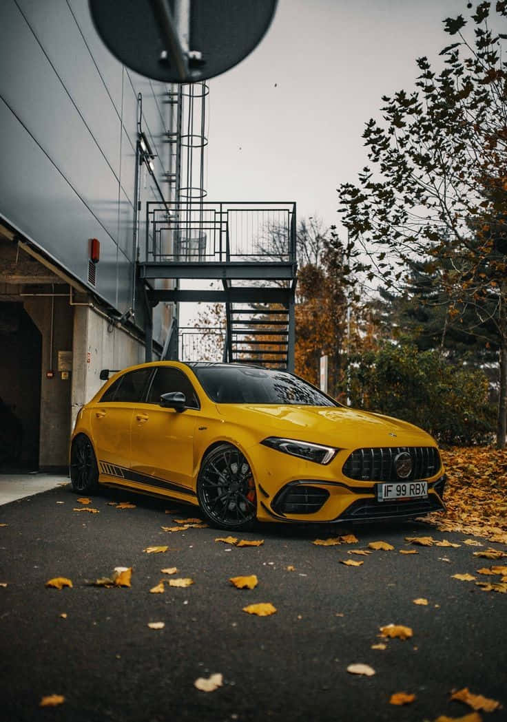 Stylish Red Hatchback on the Road Wallpaper