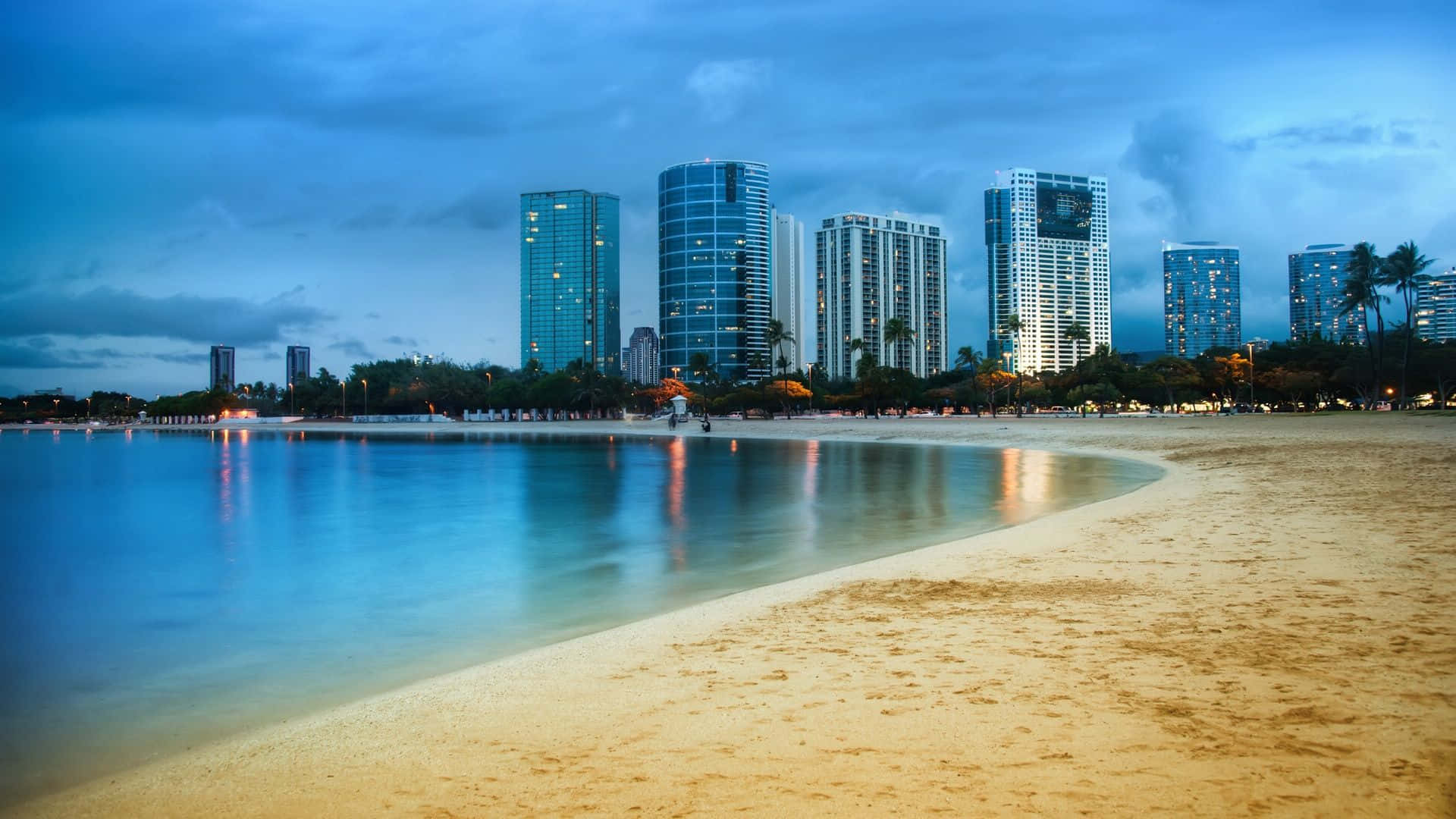 A Beach With Buildings And A Beach In The Distance Wallpaper