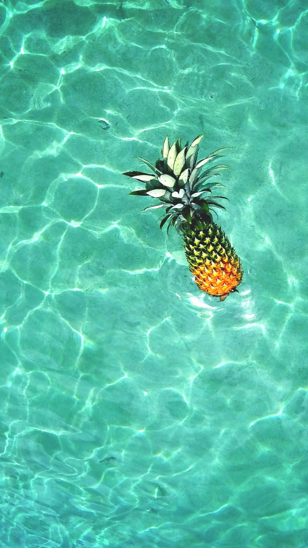 Floating Pineapple In Hawaiian Background