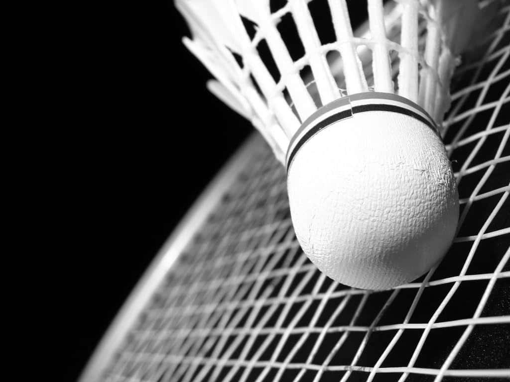 Three Badminton Athletes Compete in a Fast-Paced Match