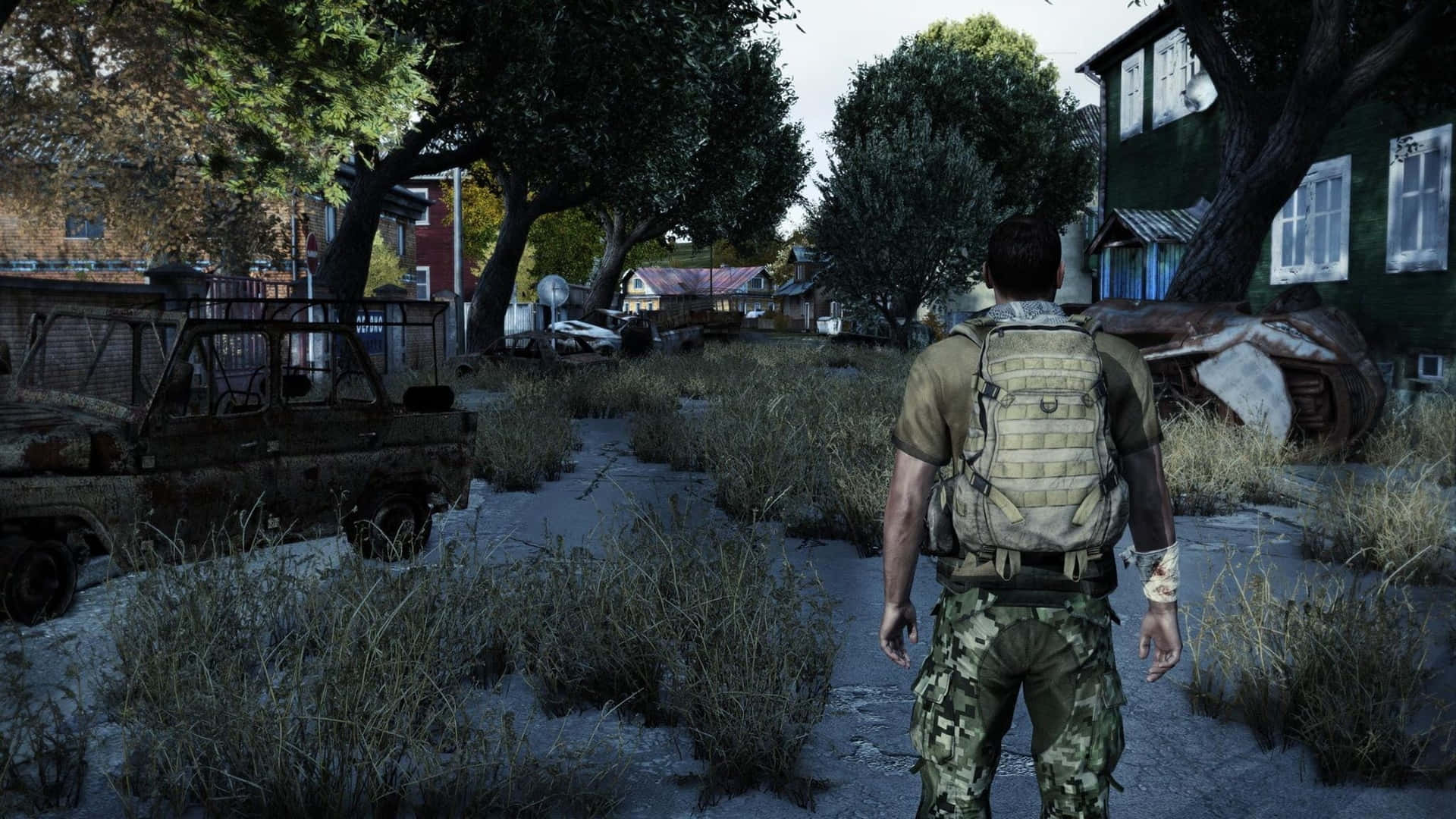 A Man Walking Through A Town In A Video Game