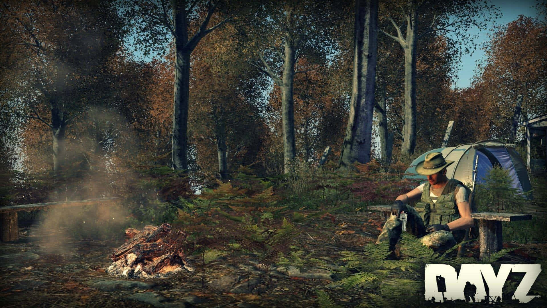 A Man Is Sitting In The Woods Near A Campfire