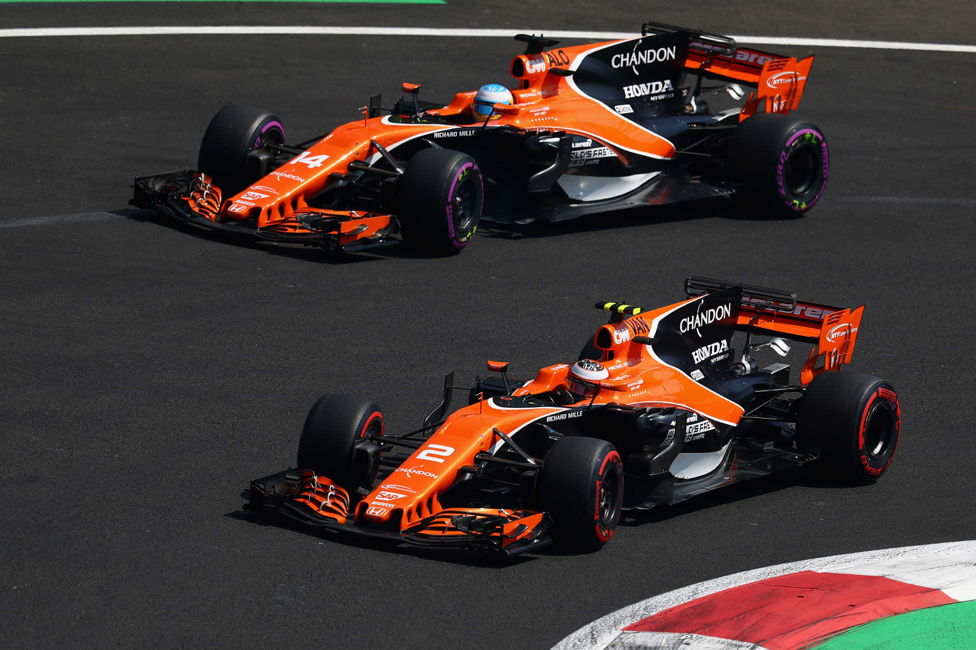 Two Orange Racing Cars