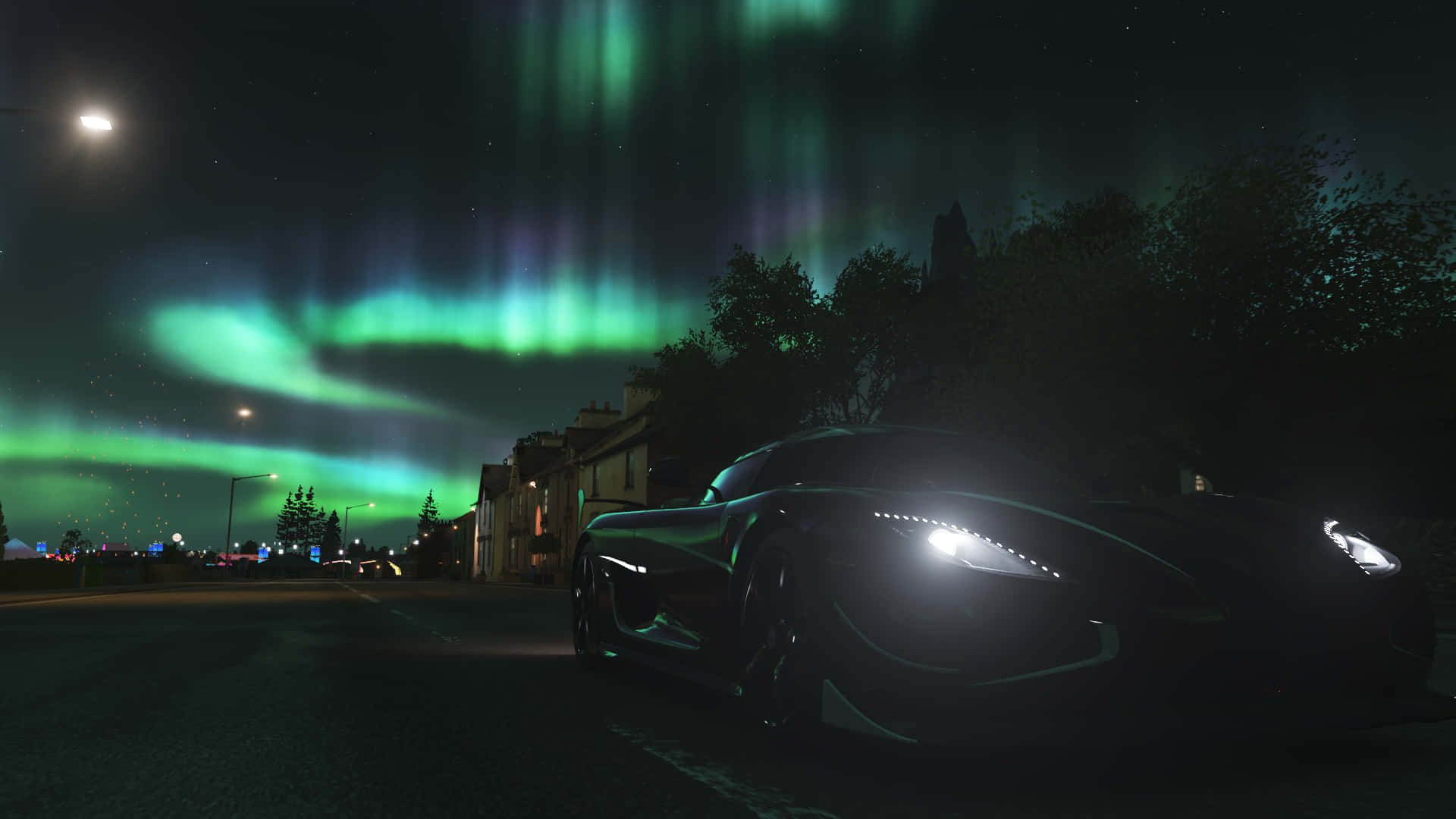 A Car Is Parked In Front Of The Aurora Borealis