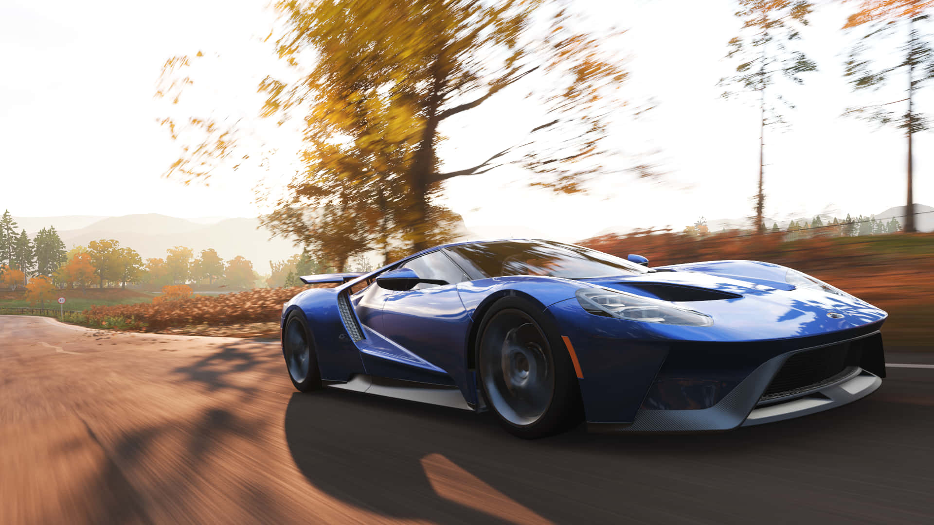 A Blue Sports Car Driving Down A Road In A Game