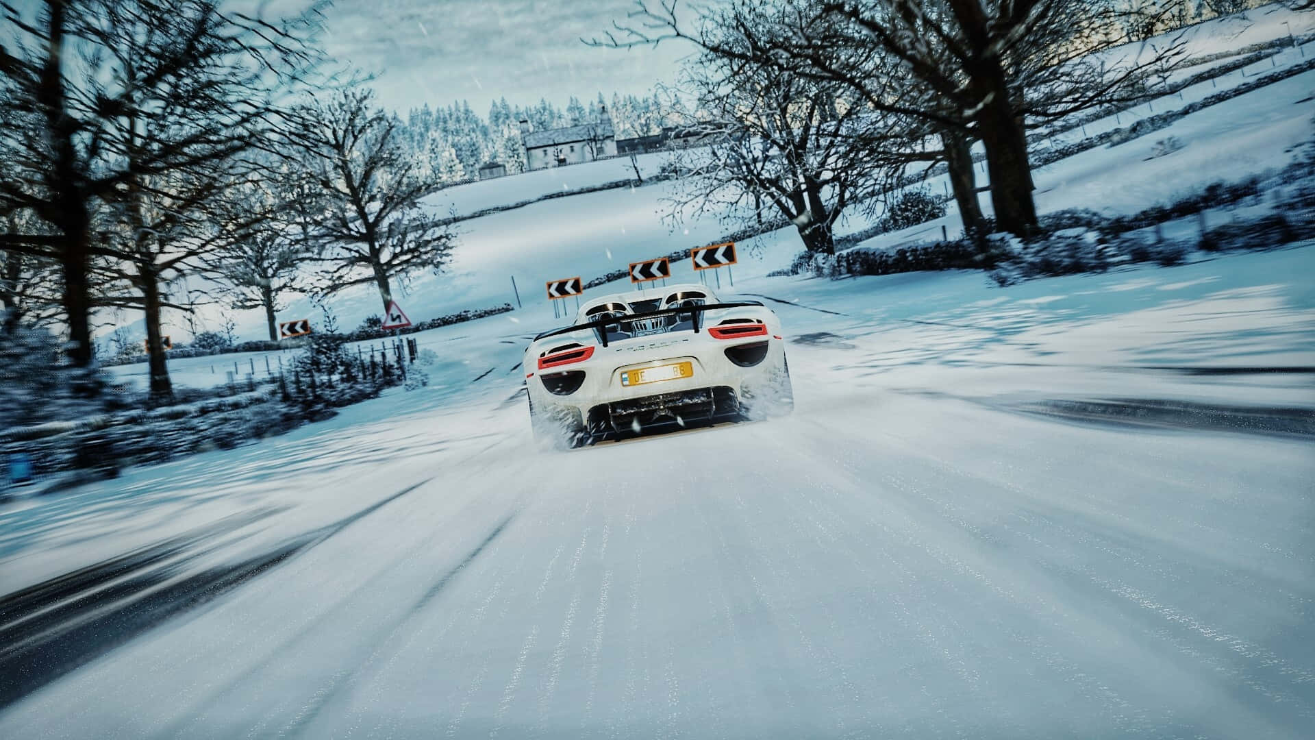 A Car Driving Down A Snowy Road