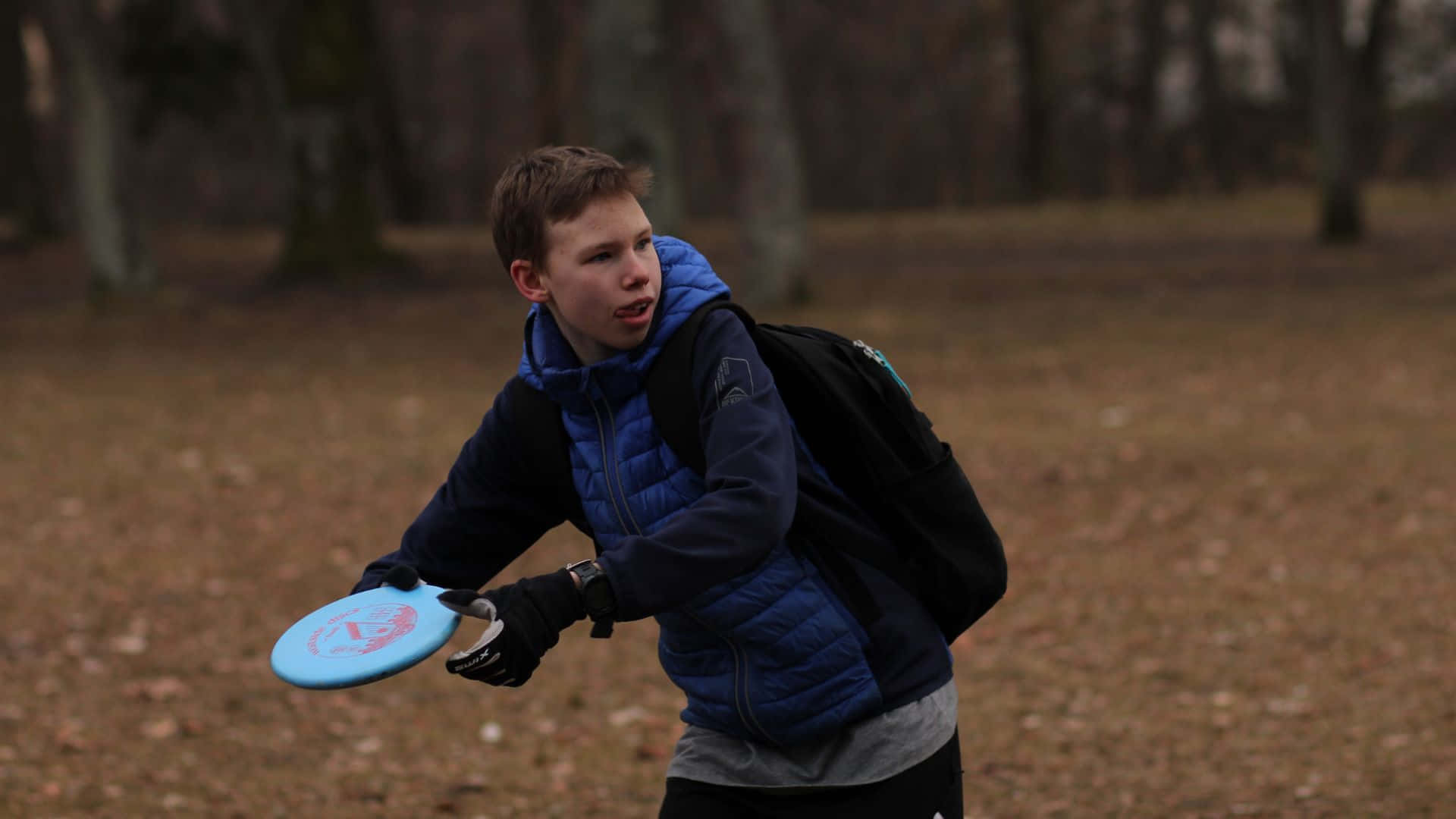 A Boy Is Playing Frisbee