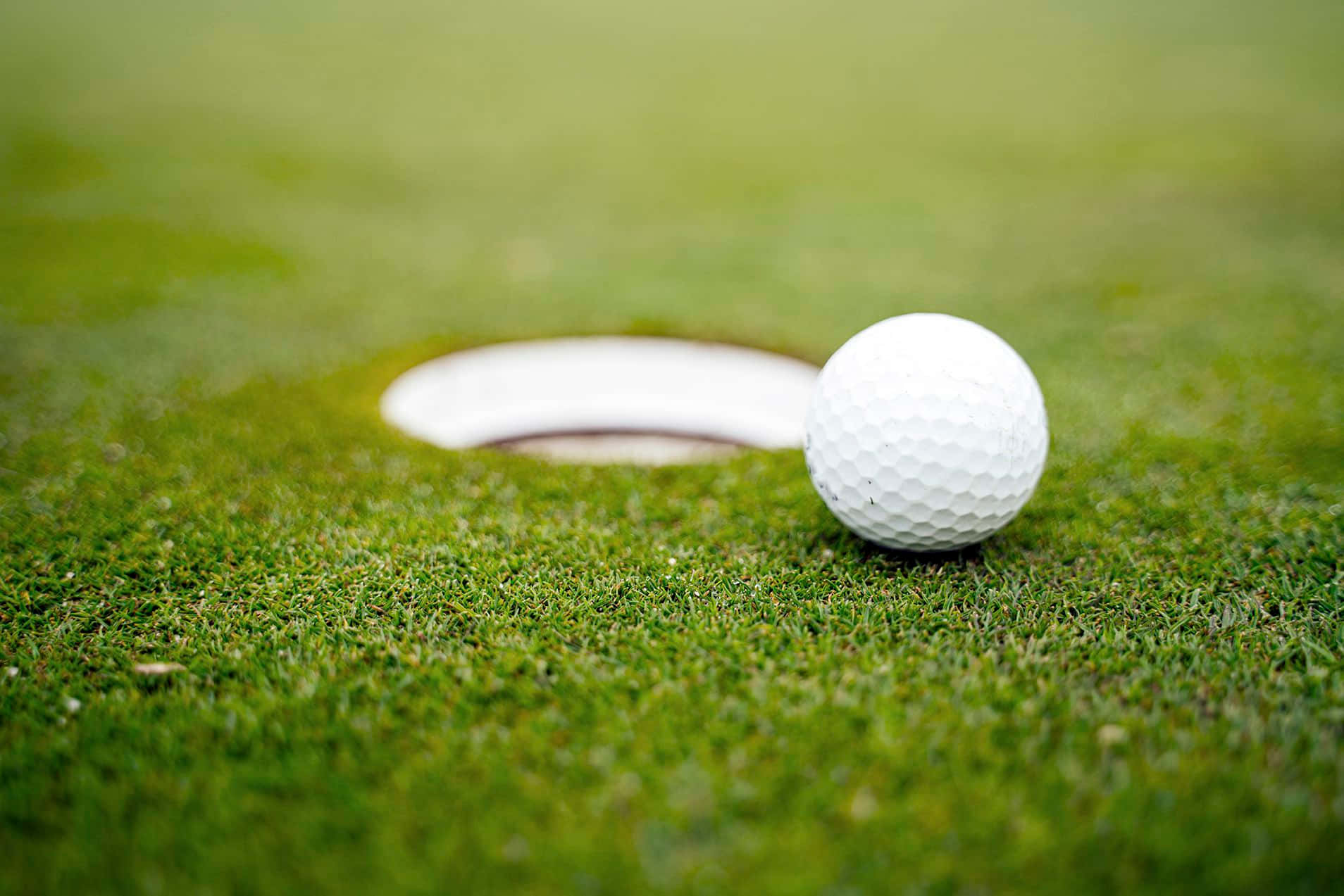 Close-up Ball On Hd Golf Course Background