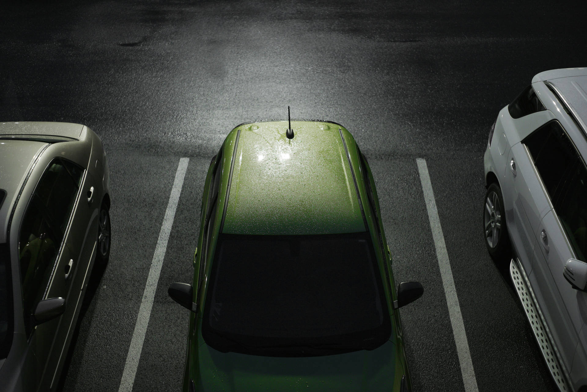 Hd Green Car Parked In Parking Lot Wallpaper