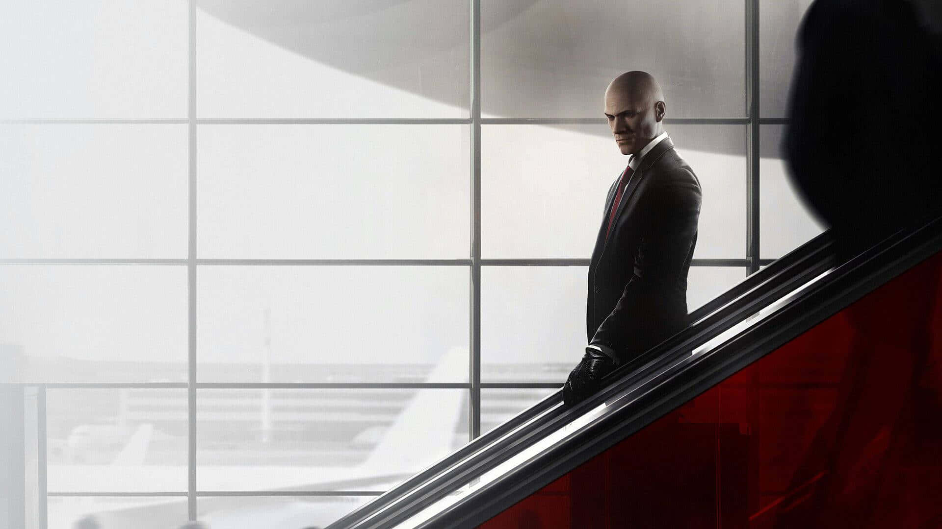 Agent 47, dressed in his signature suit and tie, disposes of a criminal in a game of cat and mouse.