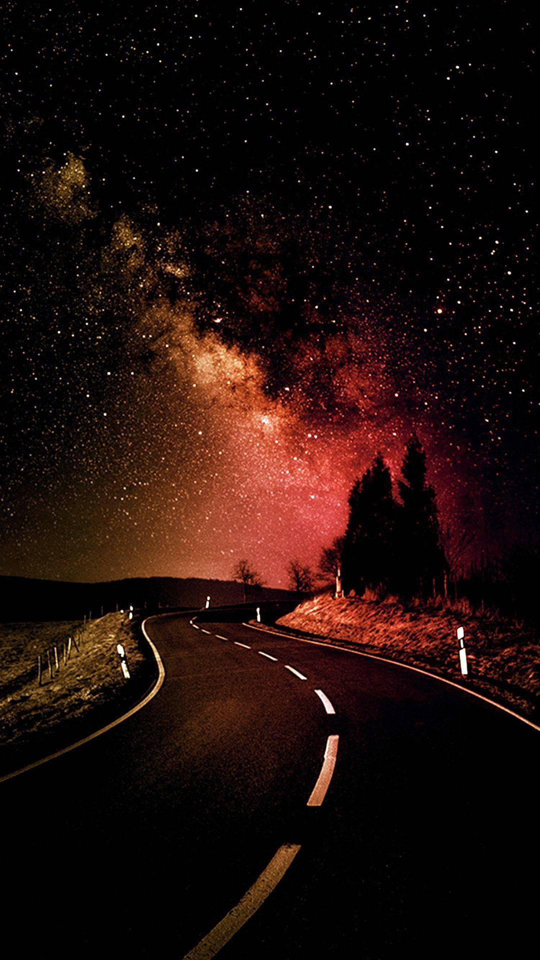 HD wallpaper of road under the pink cosmic galaxy. 