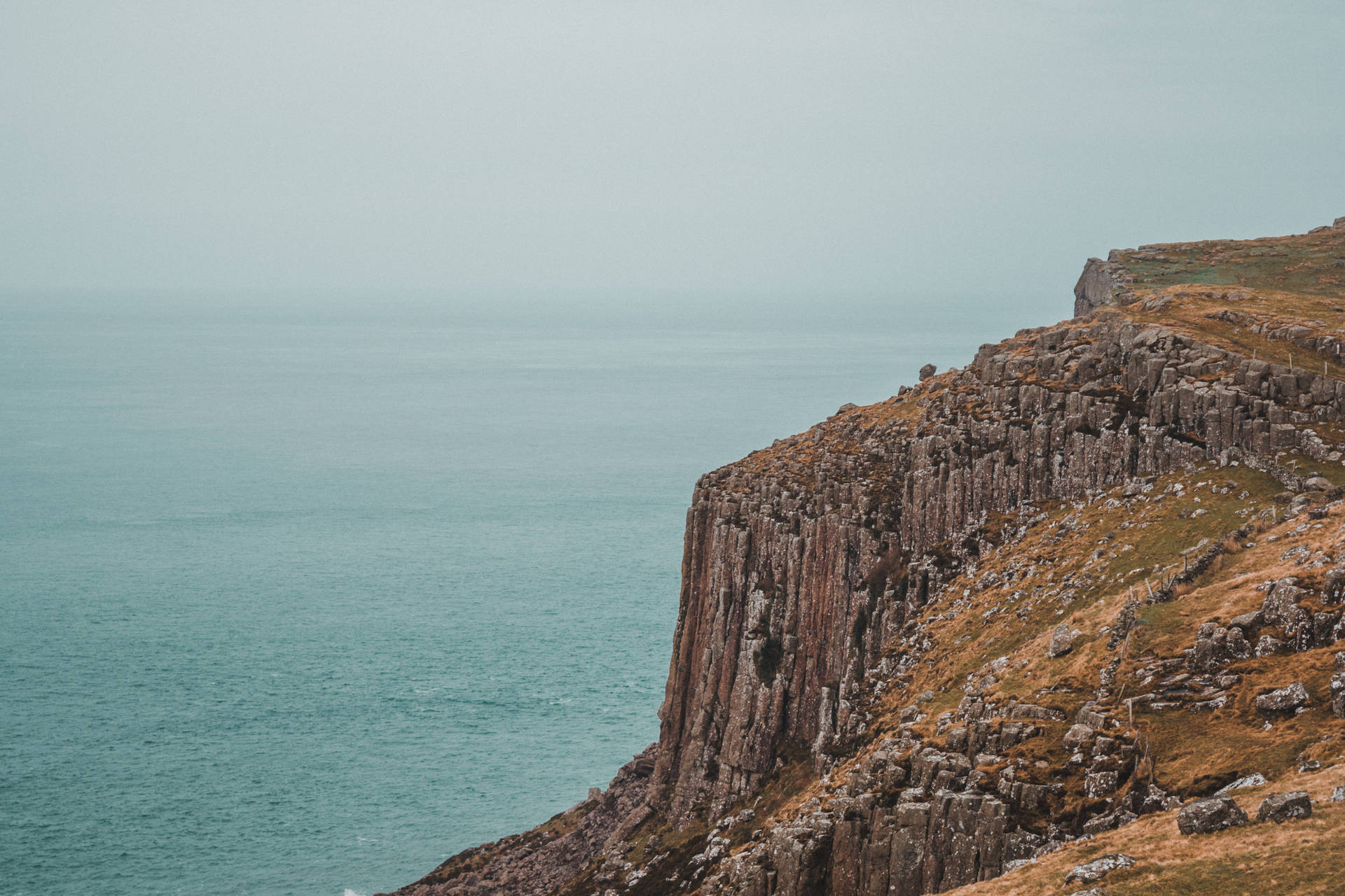 Glorious rocky cliffs overlooking the ocean Wallpaper