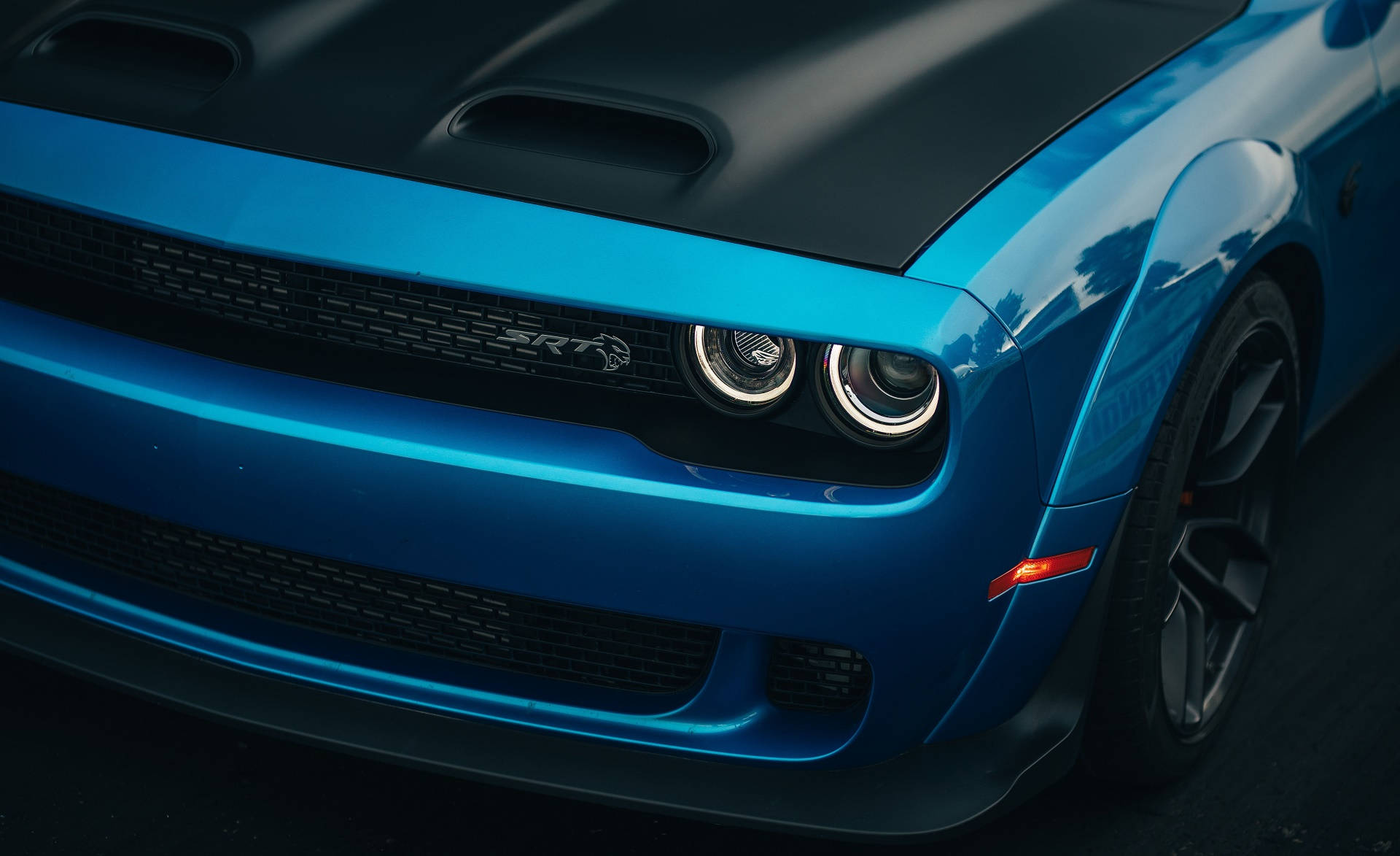 Headlights Of A Blue Dodge Challenger Wallpaper