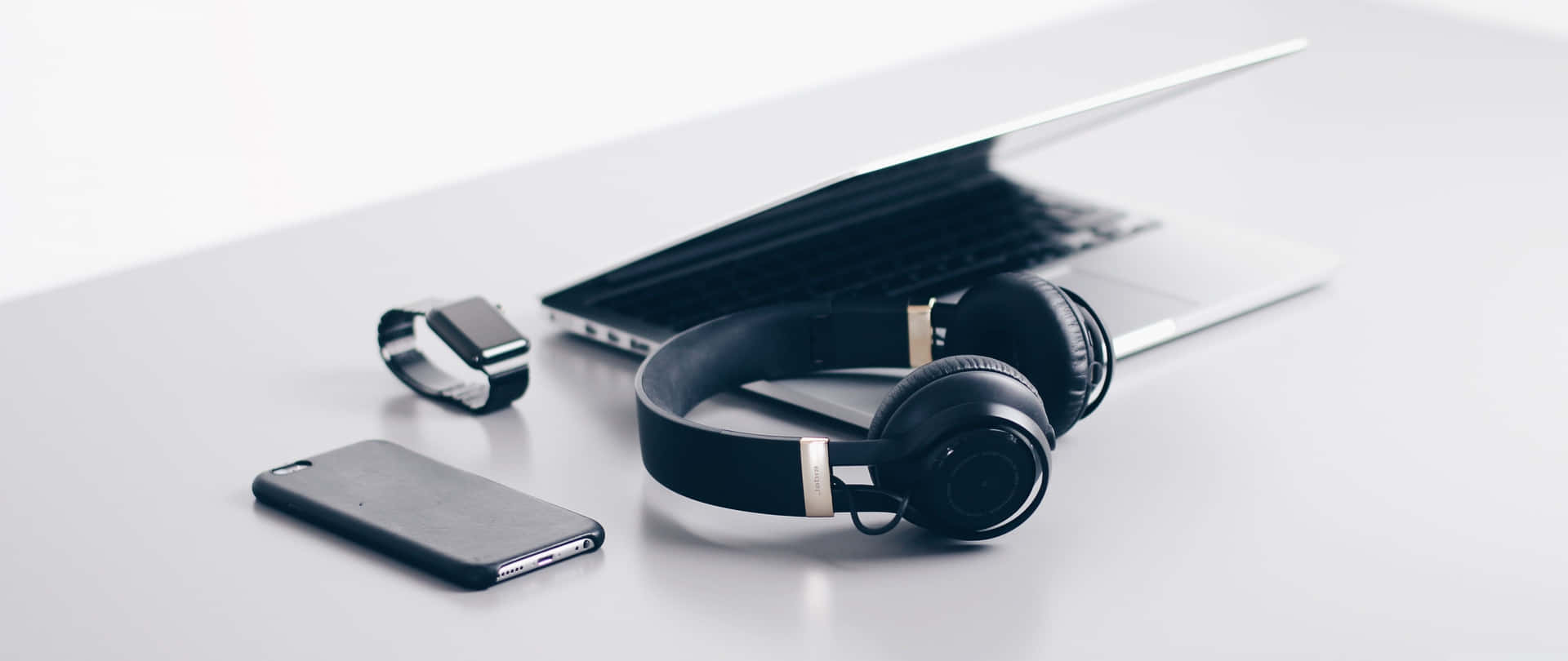 Enhancing Your Laptop Audio with Headphones Wallpaper