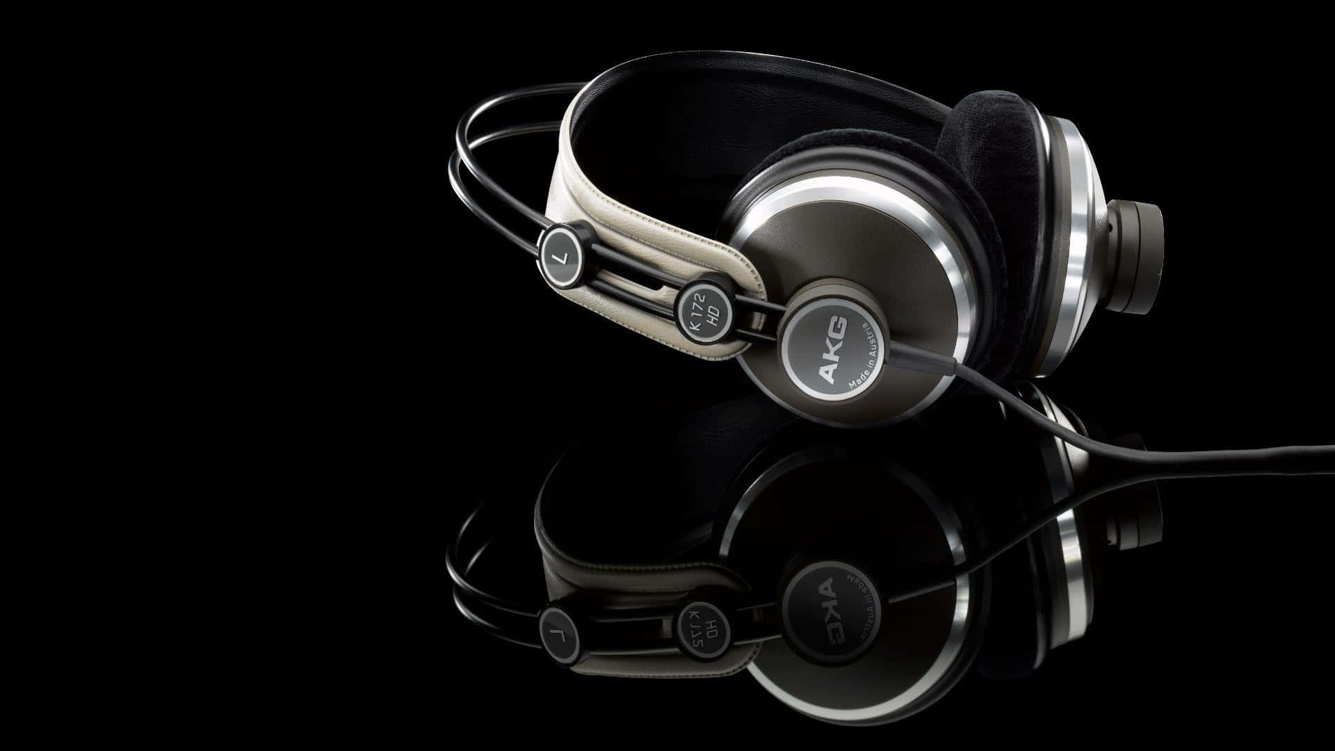 A Pair Of Headphones On A Black Background
