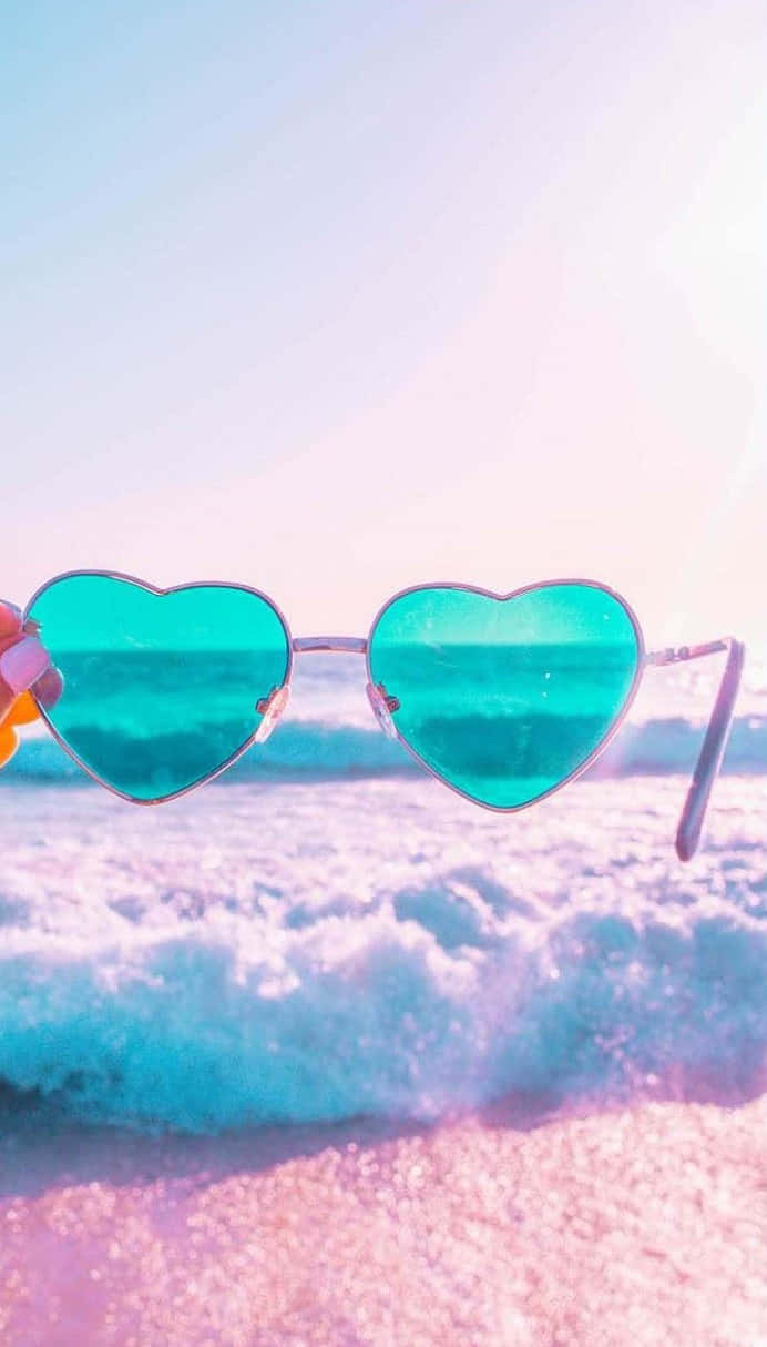 Heart Shaped Sunglasses Beach Backdrop Wallpaper