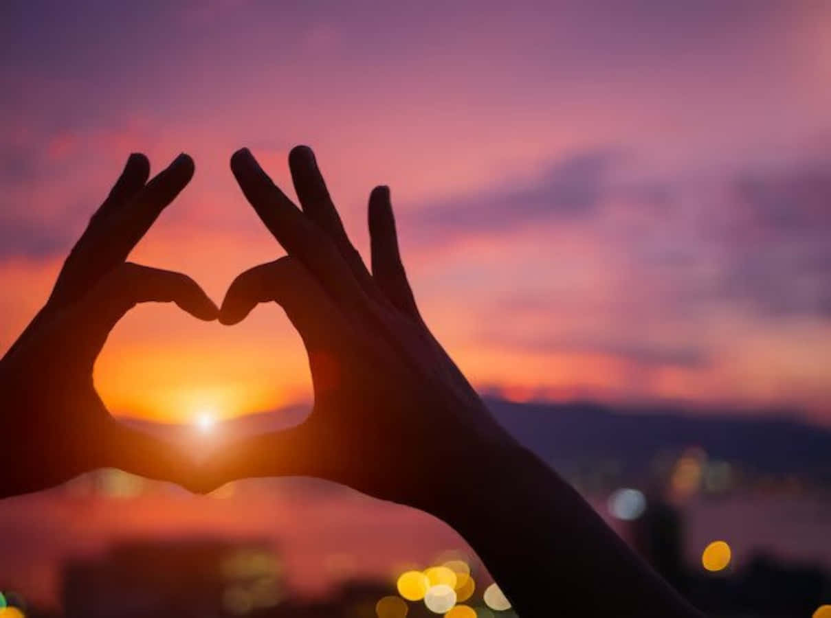 Heart Silhouette in a Sunset Sky Wallpaper