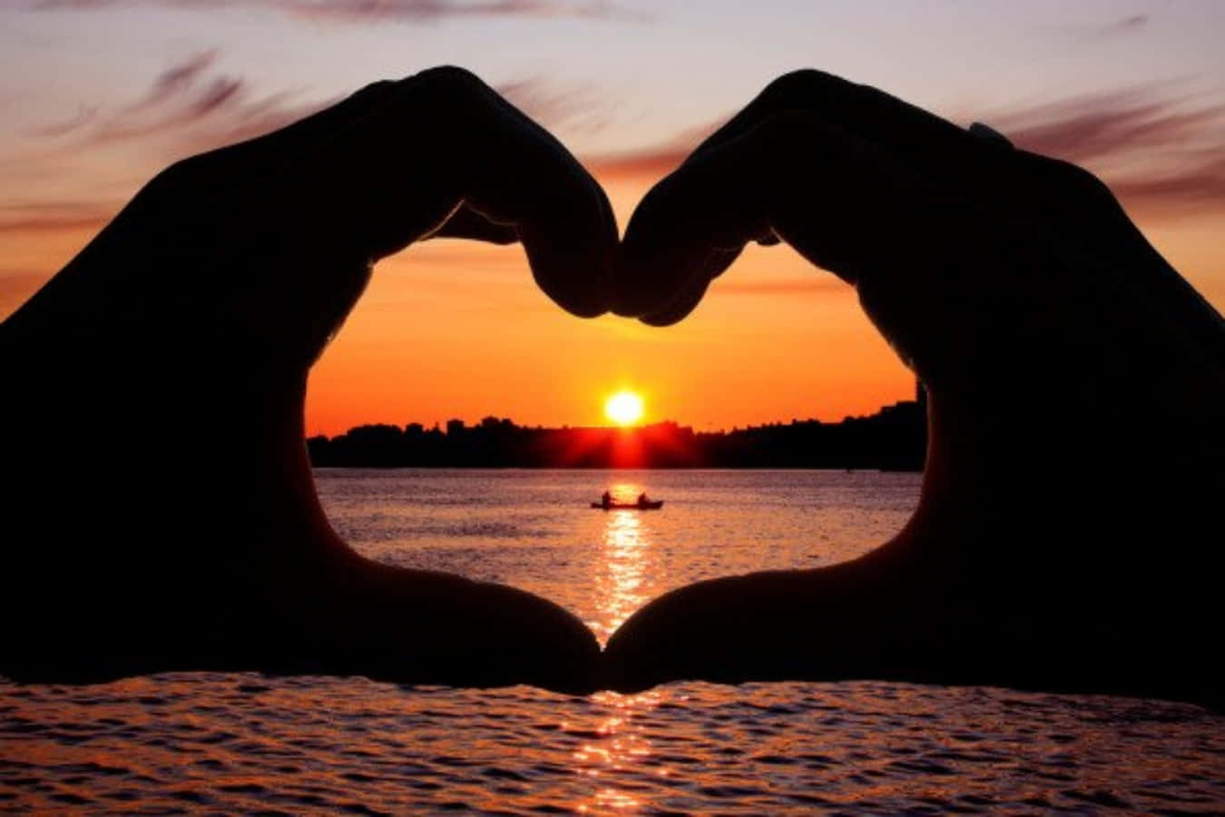 Heart Shaped Silhouette on a Sunset Sky Wallpaper