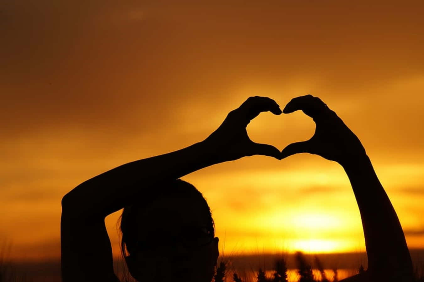 Heart Shaped Silhouette at Sunset Wallpaper