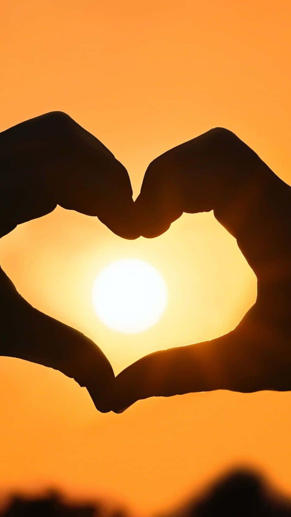Loving Embrace: Heart Silhouette at Sunset Wallpaper