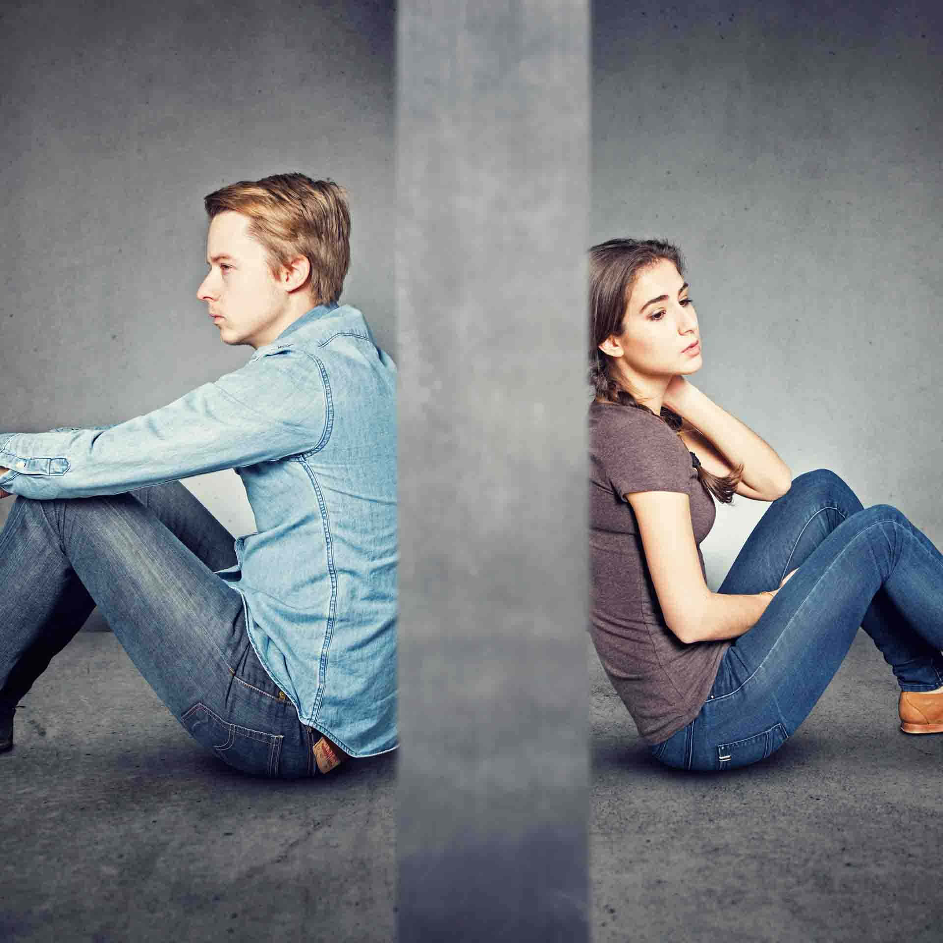 Two People Sitting On The Ground, One Is Sitting On The Floor And The Other Is Sitting On The Floor