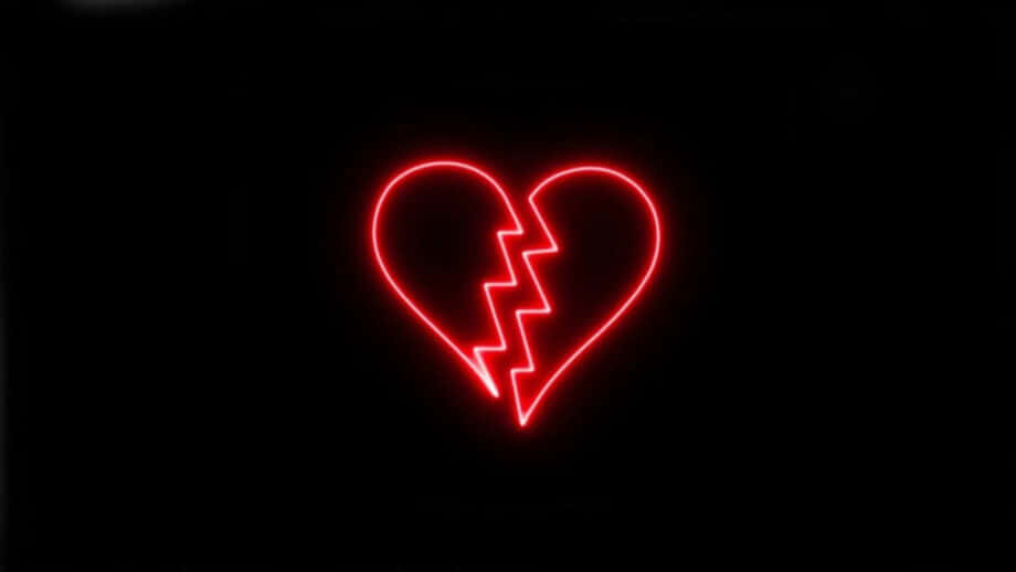 a broken heart is shown on a black background