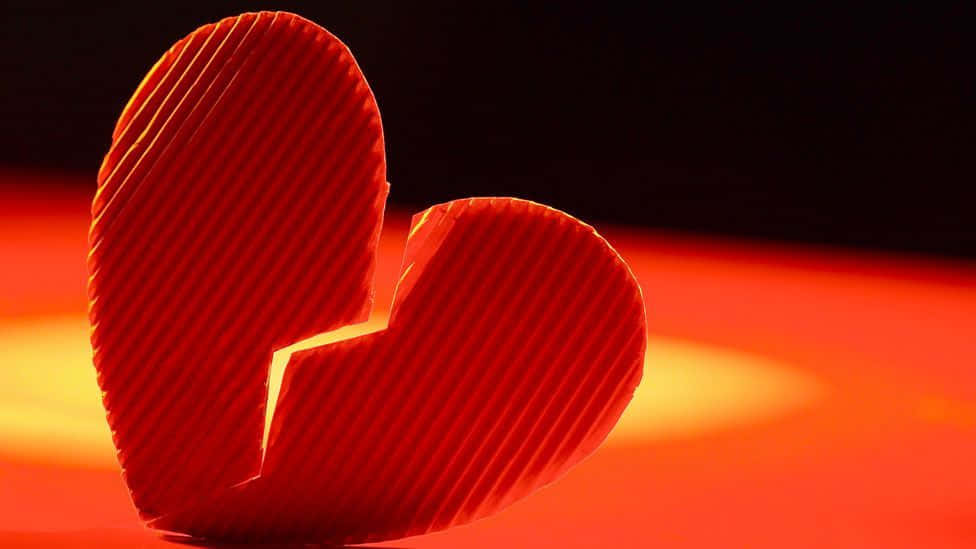 a broken heart is shown on a red background