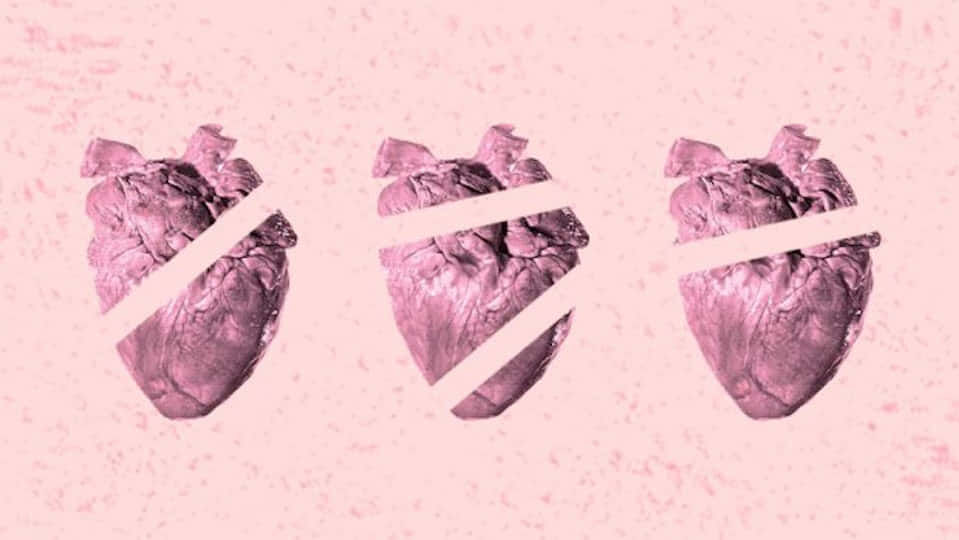 three hearts on a pink background