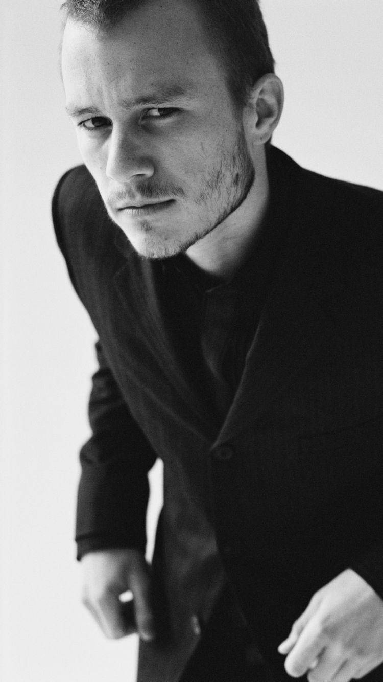 Heath Ledger In Black Coat Wallpaper