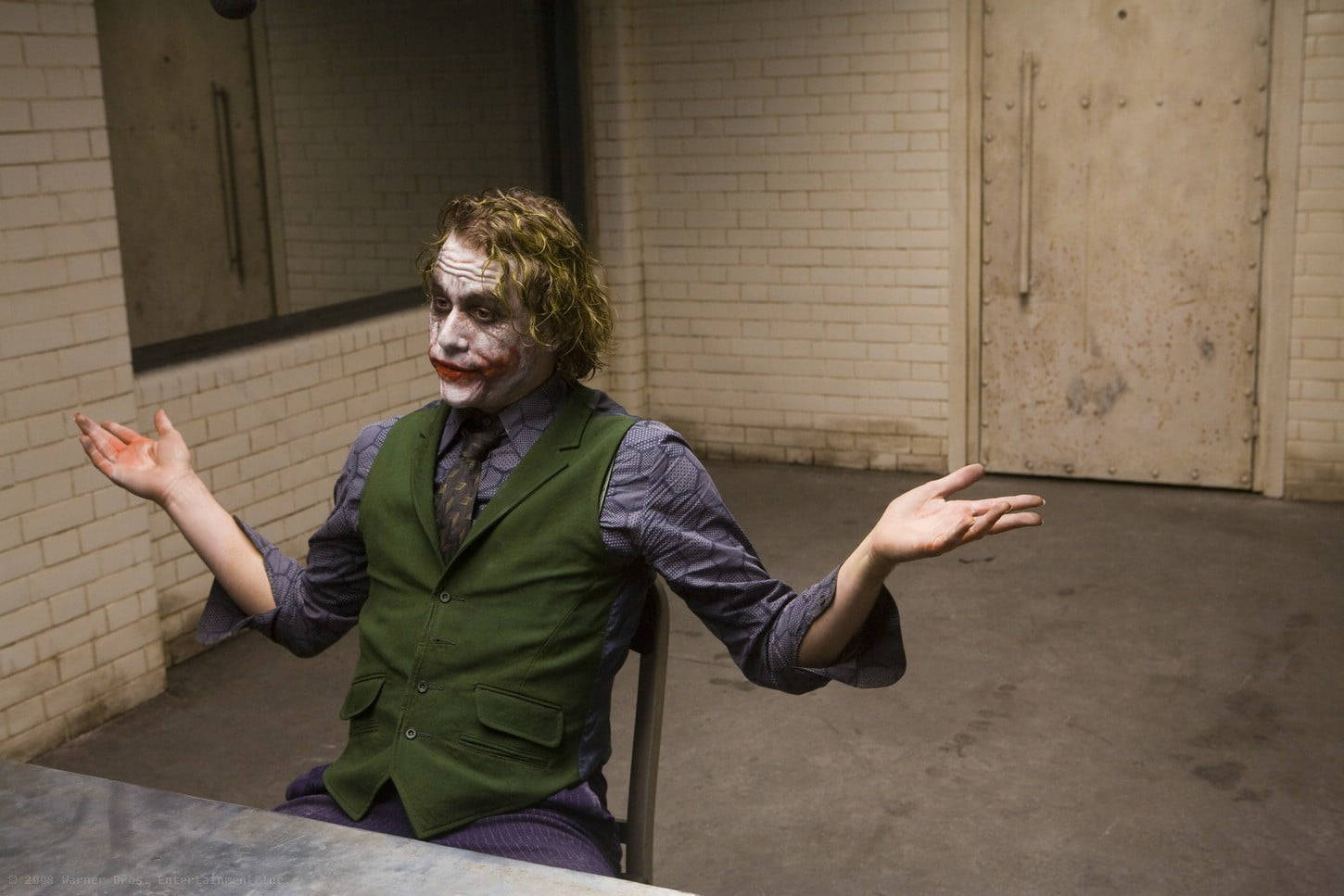 Heath Ledger Joker Interrogation Shrugging Wallpaper