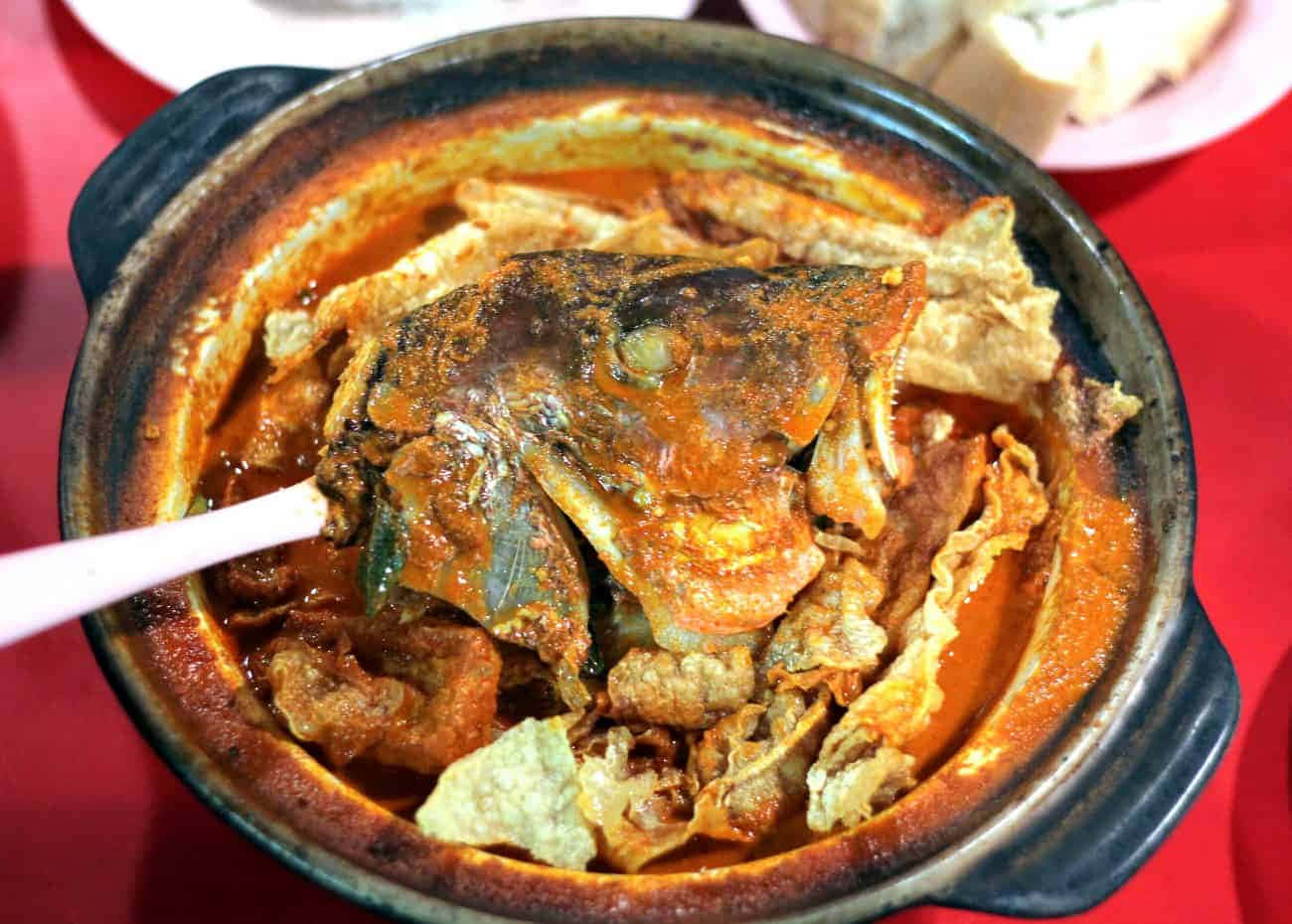 Heavenly Fish Head Curry in a Black Ceramic Pot Wallpaper