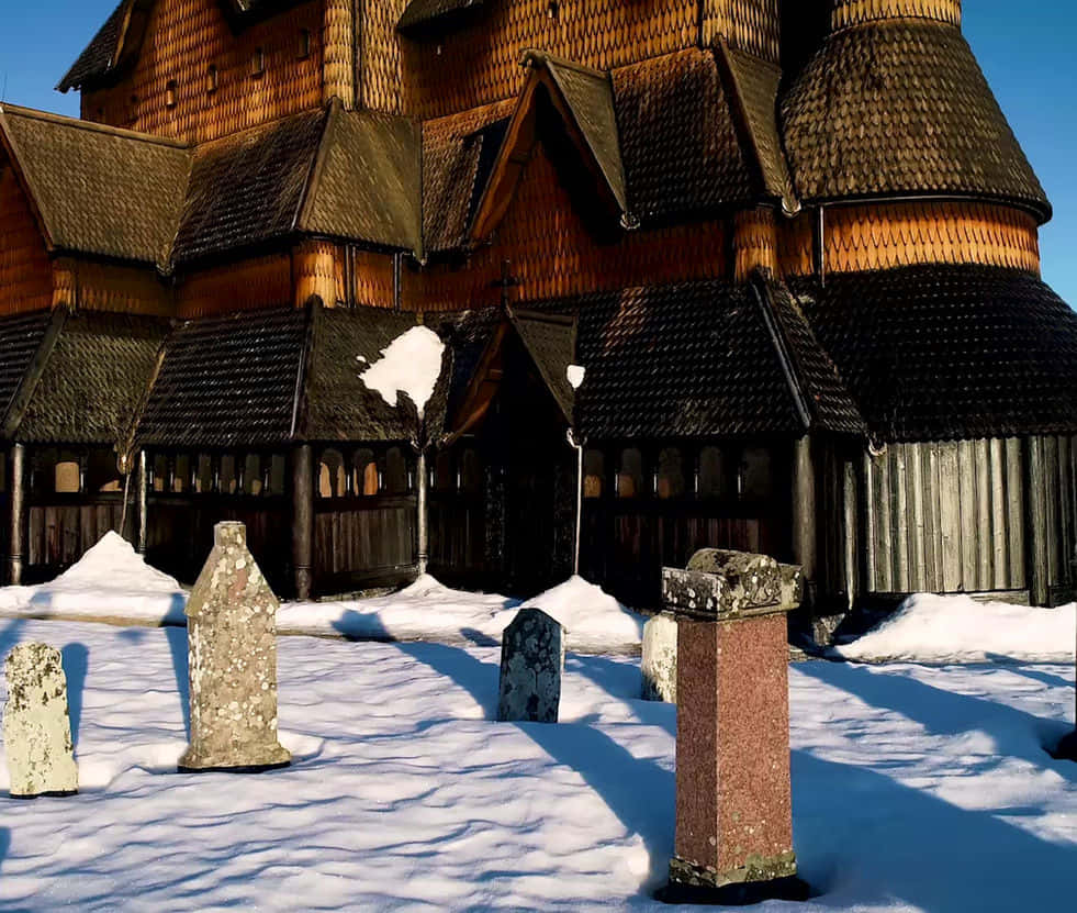 Heddal Stave Church Graveyard With Snow Wallpaper