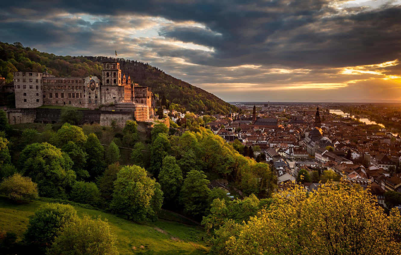 Castellodi Heidelberg Al Tramonto Arancione Sfondo