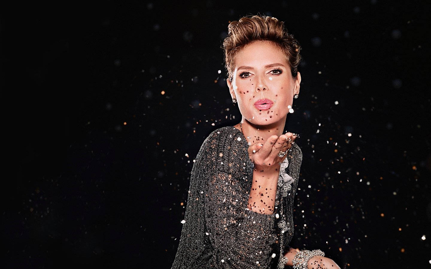 Heidi Klum Blowing Confetti Background