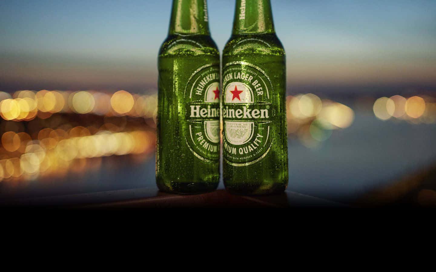 A refreshing Heineken beer bottle on a vibrant green background