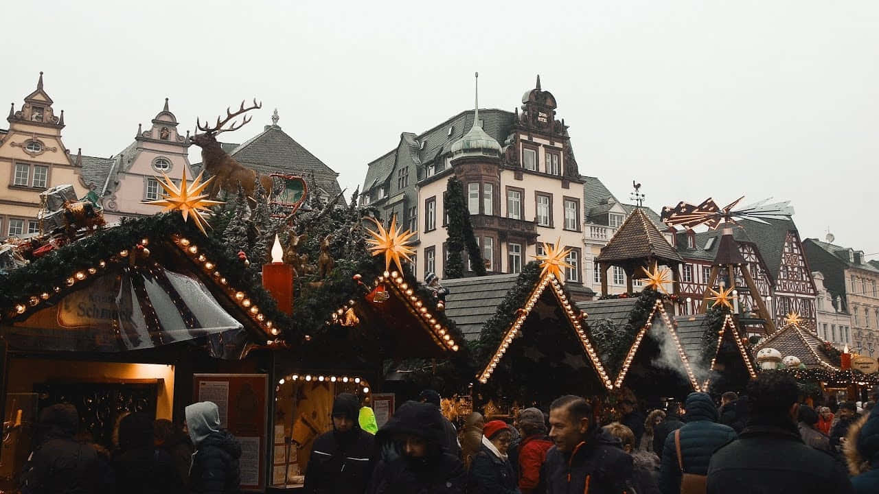 A Christmas Market With People Walking Around